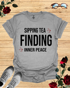 Sipping Tea Finding Inner Peace – Relaxed T-Shirt in Long & Short Sleeve Styles Printify